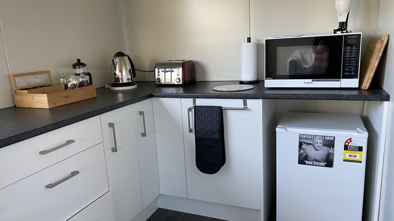 Kitchenette, with microwave & a bar fridge.