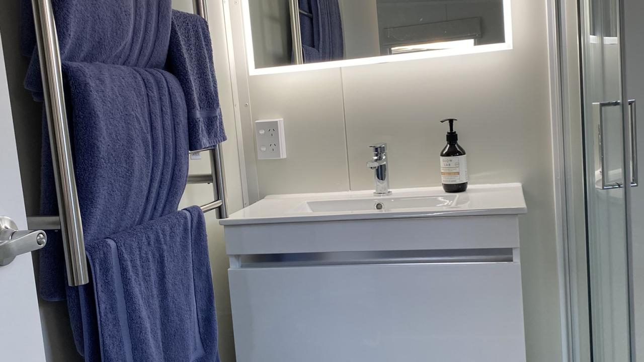 Heated towel ladder, slimline vanity, LED mirror.