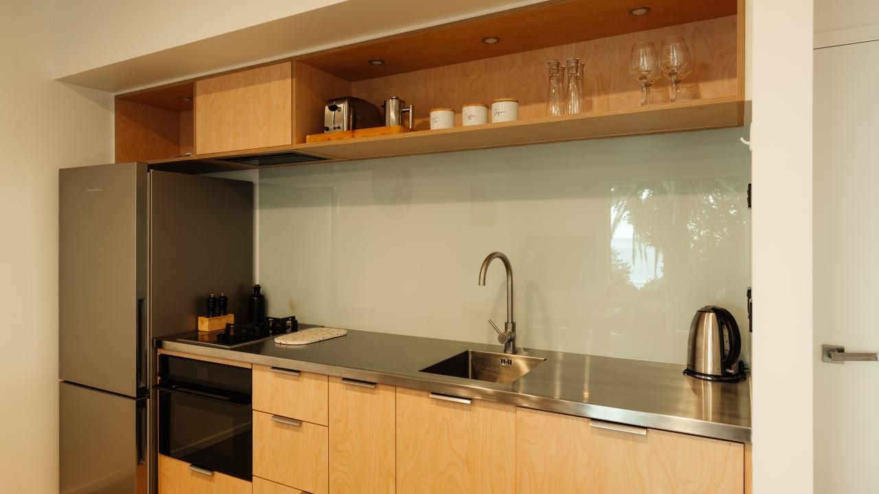 Full Kitchen with stove top, oven, microwave and fridge