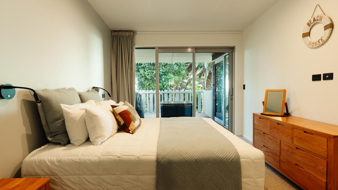 Master Bedroom with King bed and balcony access