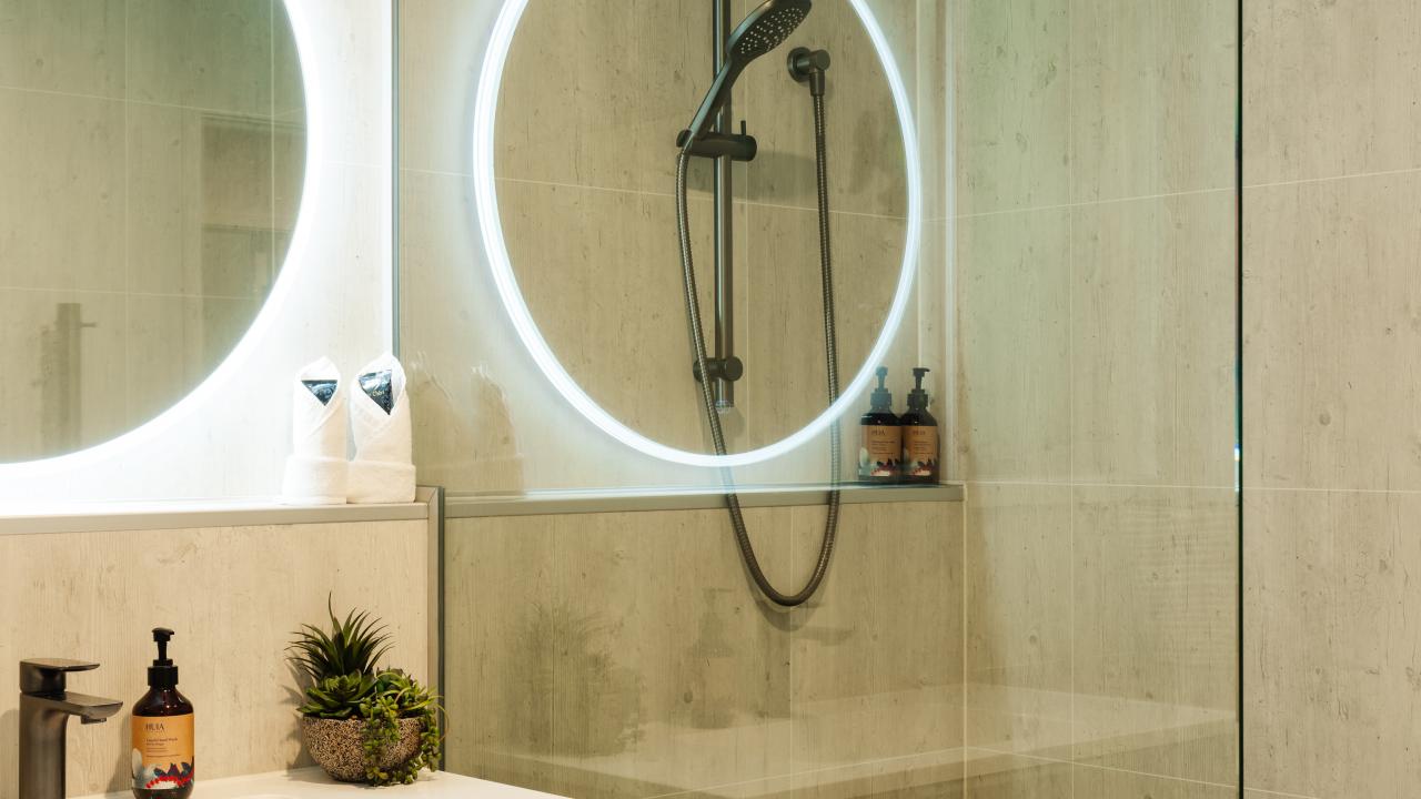 Full tiled modern bathroom with laundry