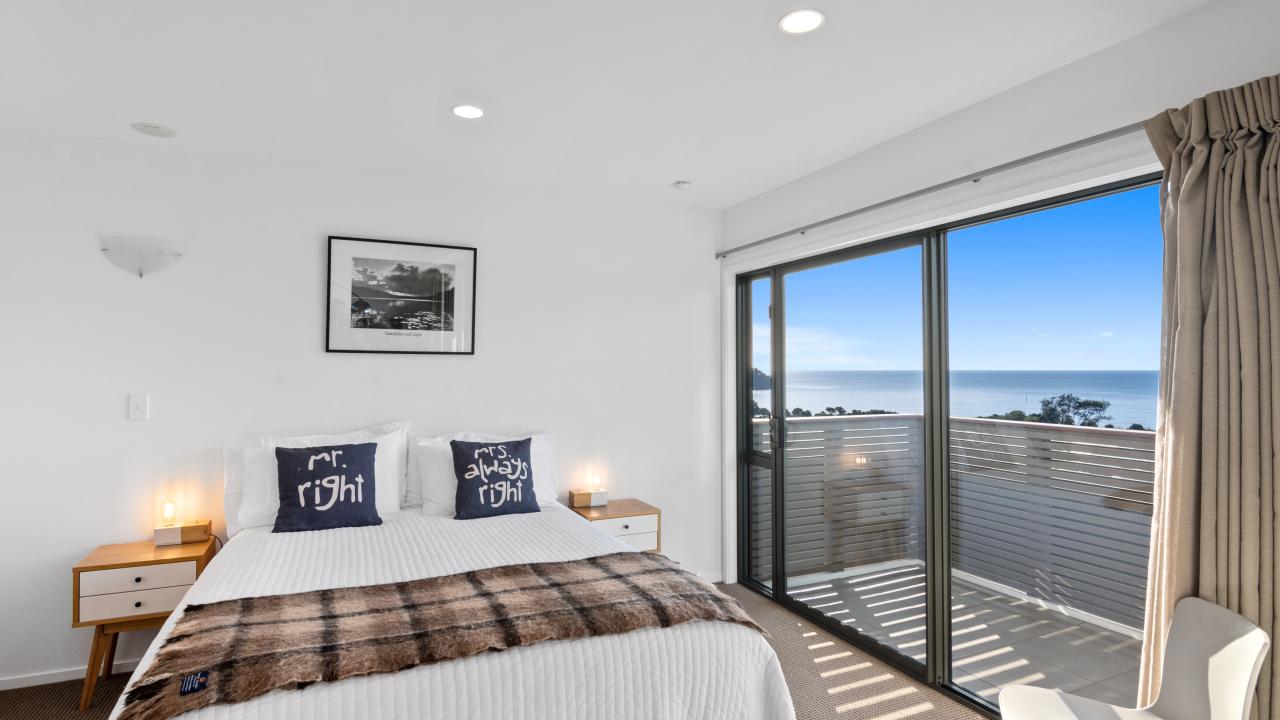 Double bedroom with Queen bed and quality linen in the Kaiteriteri Luxury Apartment