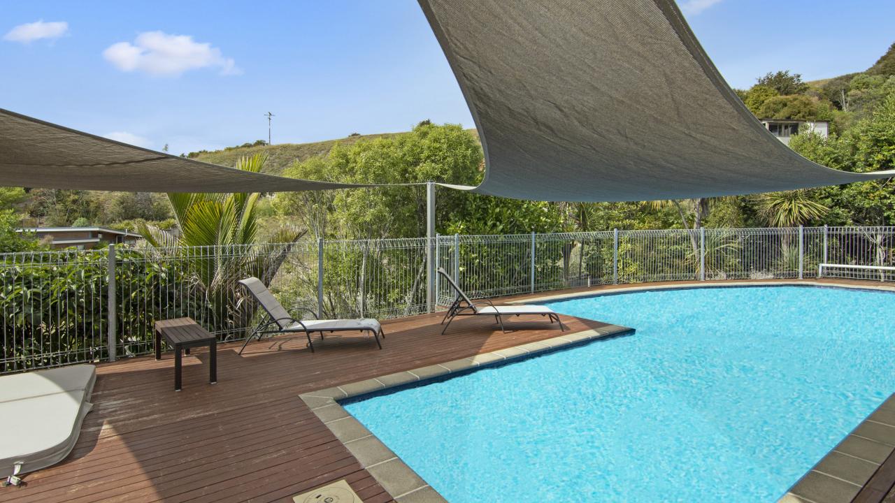 Heated swimming pool available at Kaiteriteri Luxury Apartment