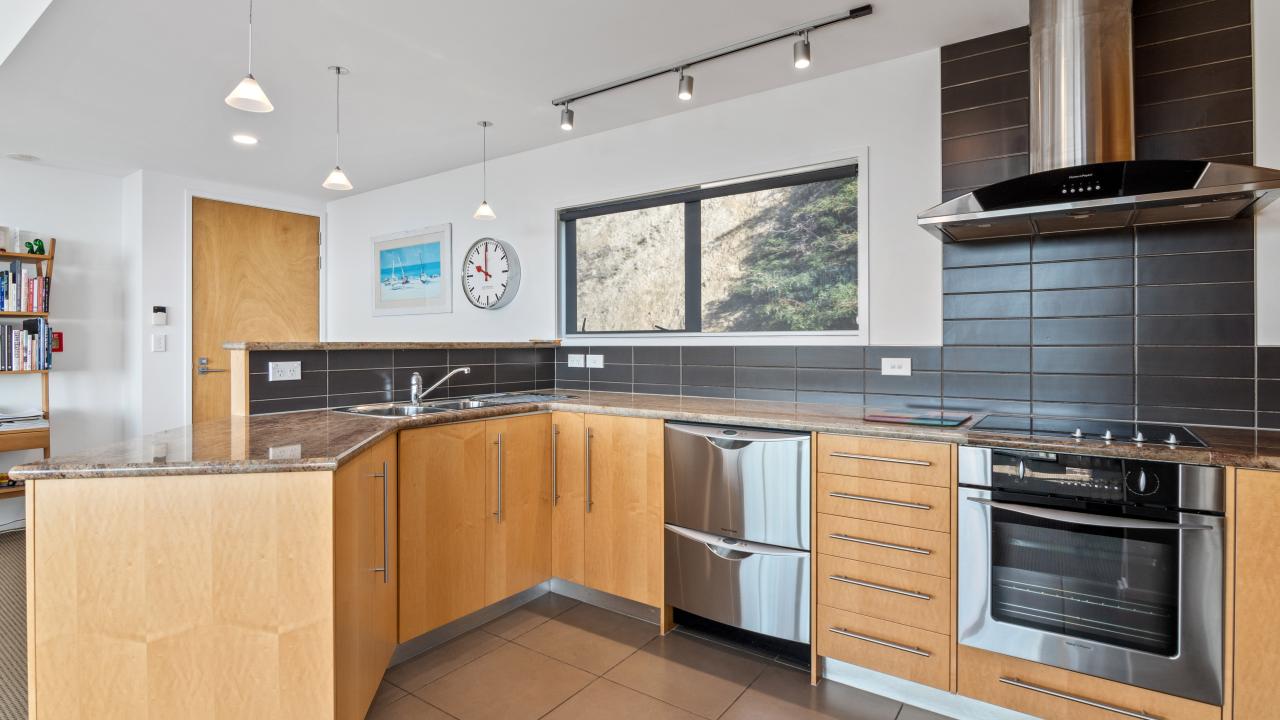 The kitchen with high quality appliances in Kaiteriteri Luxury Apartment