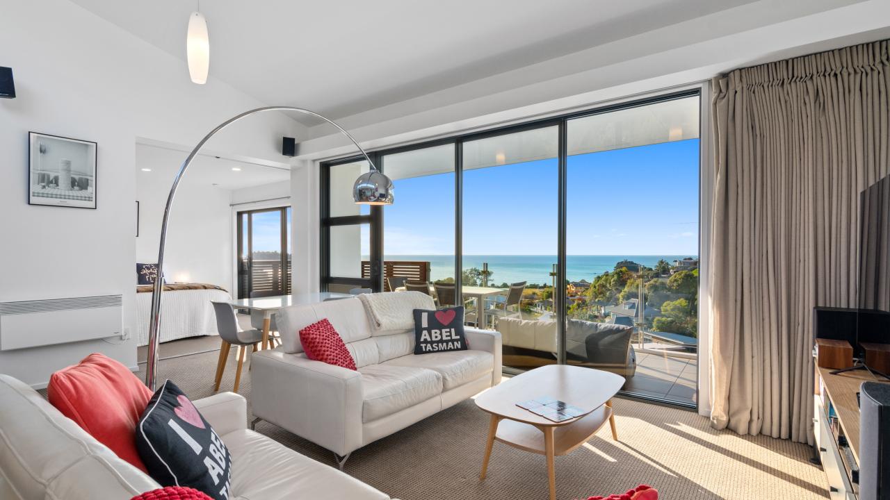 Looking out over Little Kaiteriteri Beach from the living room of Kaiteriteri Luxury Apartment