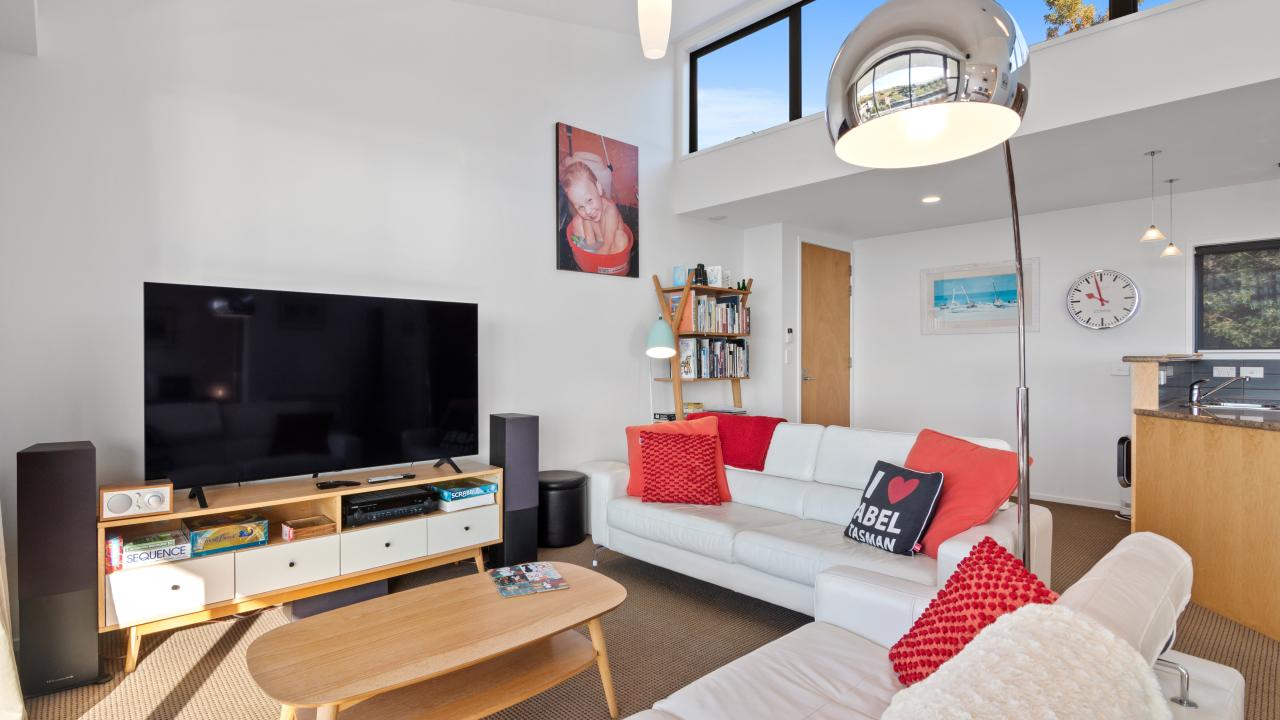 65' Smart TV and lounge area in the Kaiteriteri Luxury Apartment