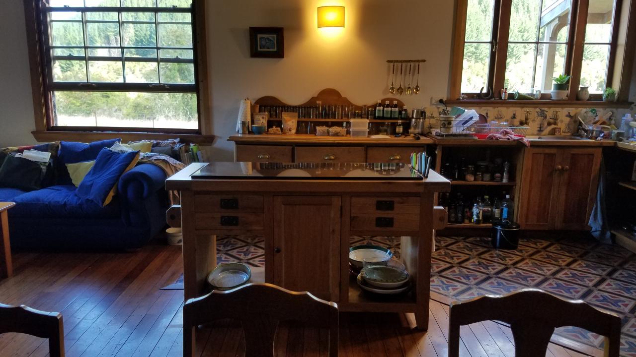 The farmhouse kitchen is comfy and a wood stove is the heart of the house.