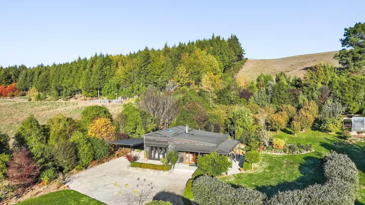The cottage with carport is located 50 metres from our house and is surrounded by garden to provide its own private haven.