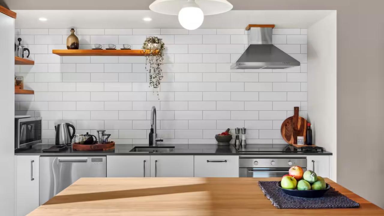 The full sized kitchen has an induction cooktop, convection oven, microwave, dishwasher and fridge freezer, plenty of crockery and cutlery, a stovetop coffee pot, french press and a smoothie blender.