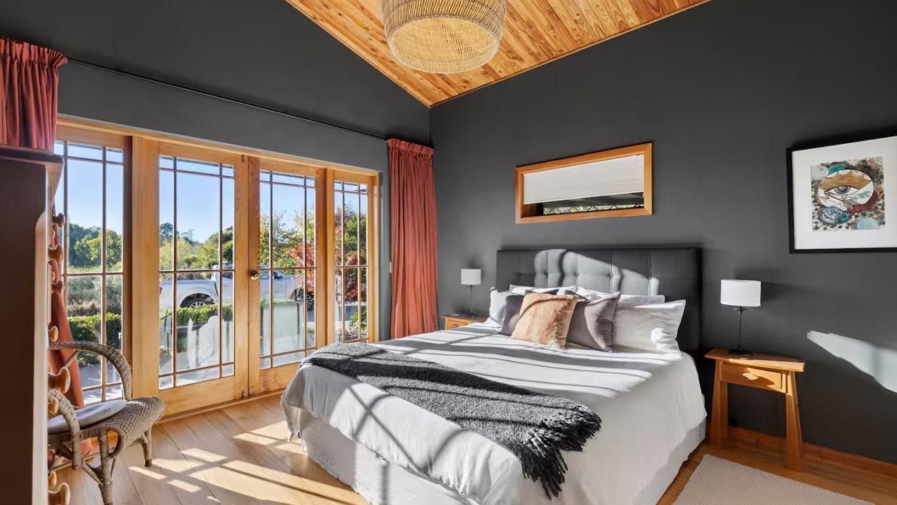 Bedroom 1 has a super king sized bed with wardrobe and luxury linens. French doors open out to a private terrace to enjoy sunny mornings