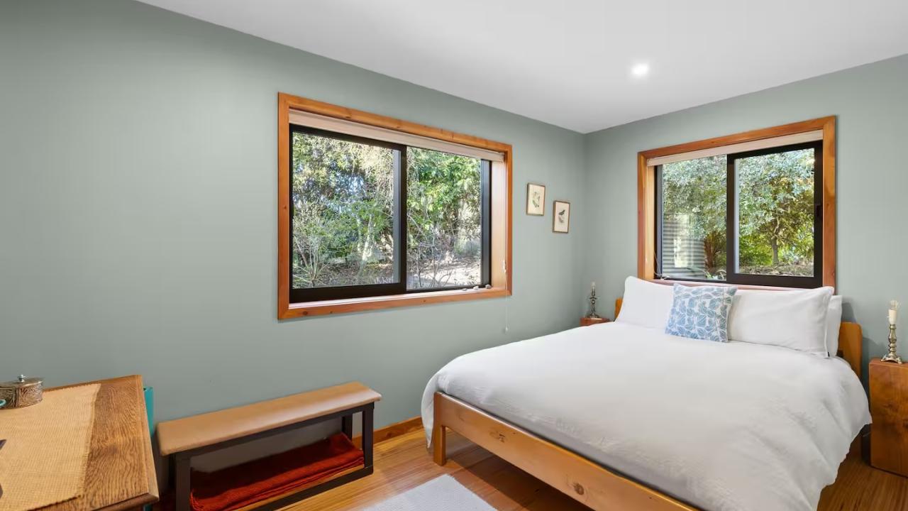 Bedroom 2 has a queen bed with luxury linens.