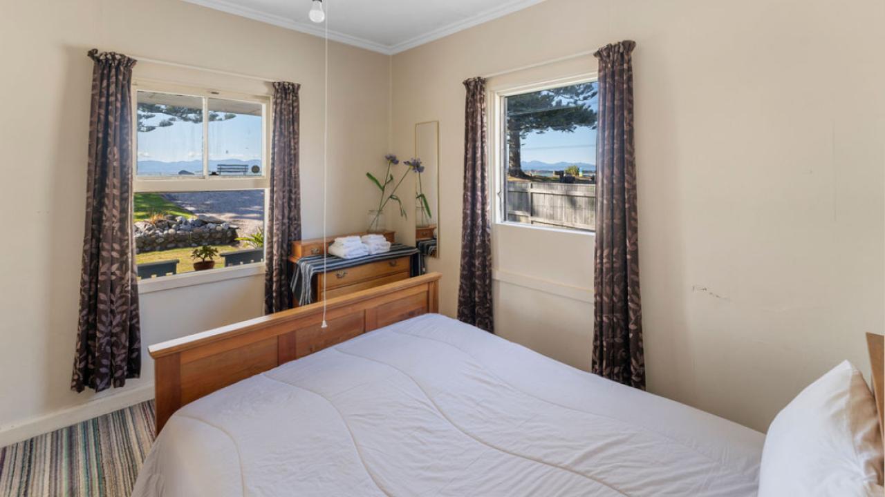 One of the queen beds looking out to the quayside