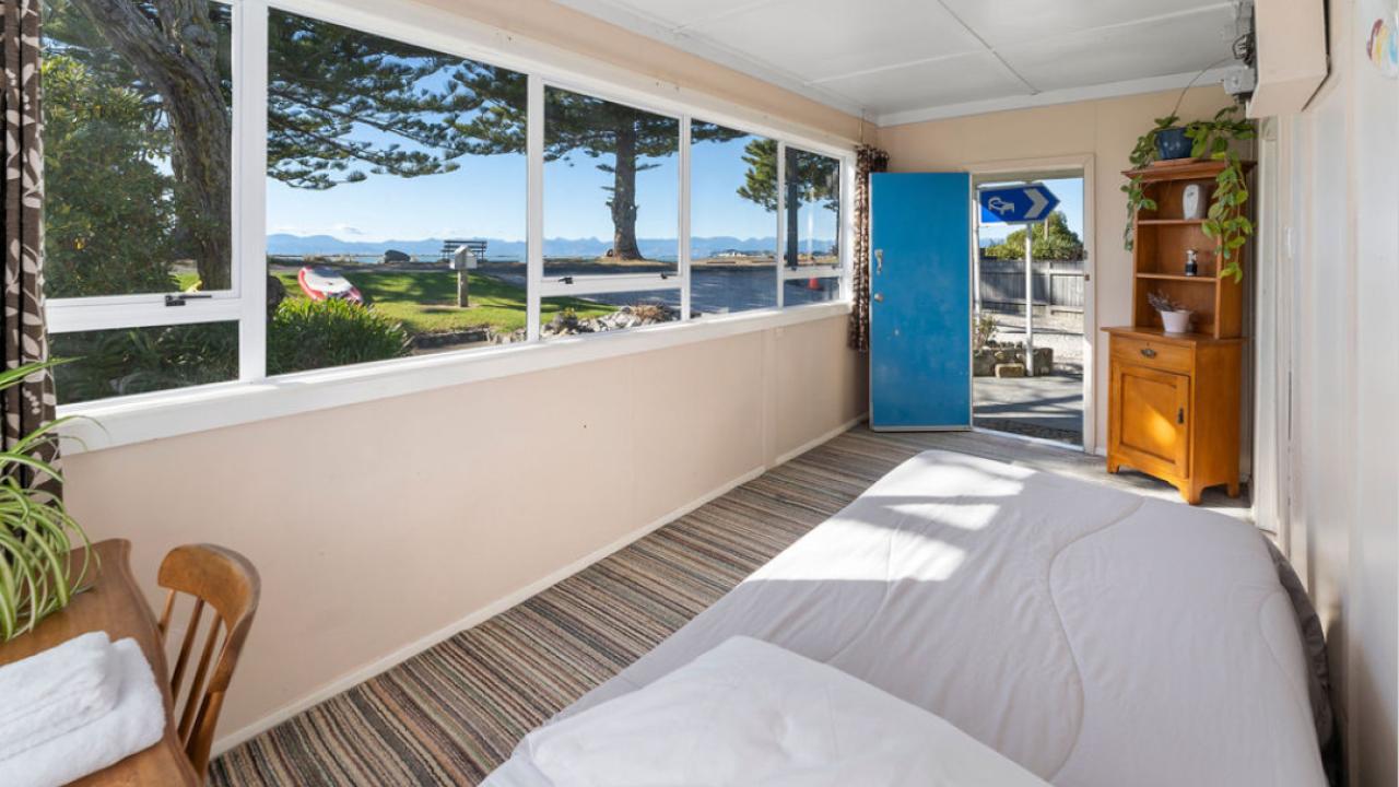 The single bedroom with views of the beachfront