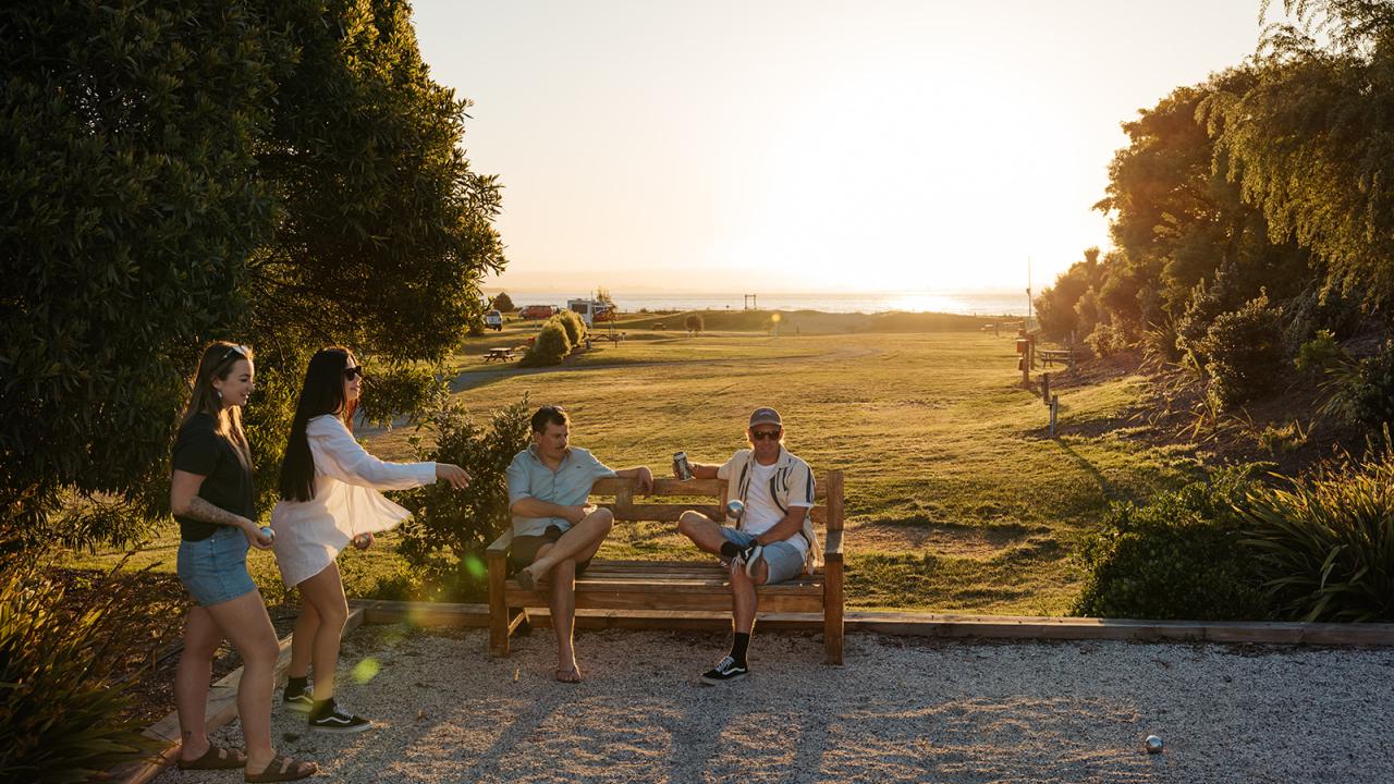 Friends playing pétanque at Tahuna Beach Holiday Park