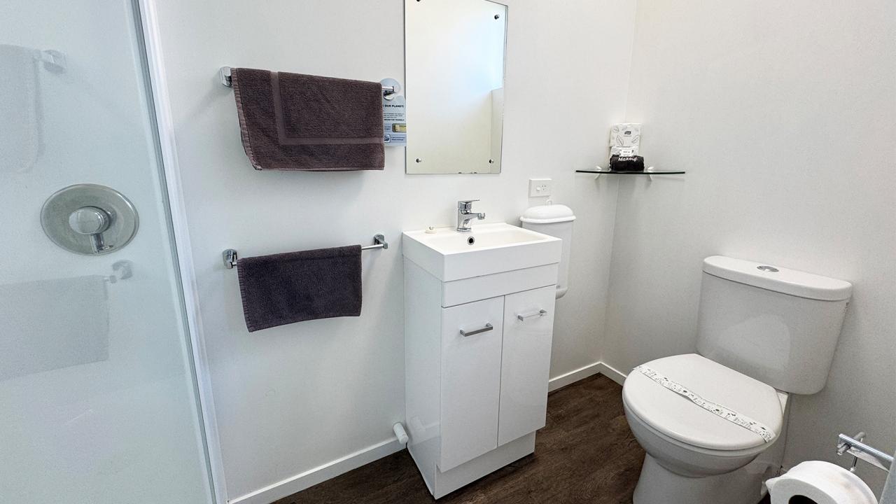 Private bathroom with shower and toilet