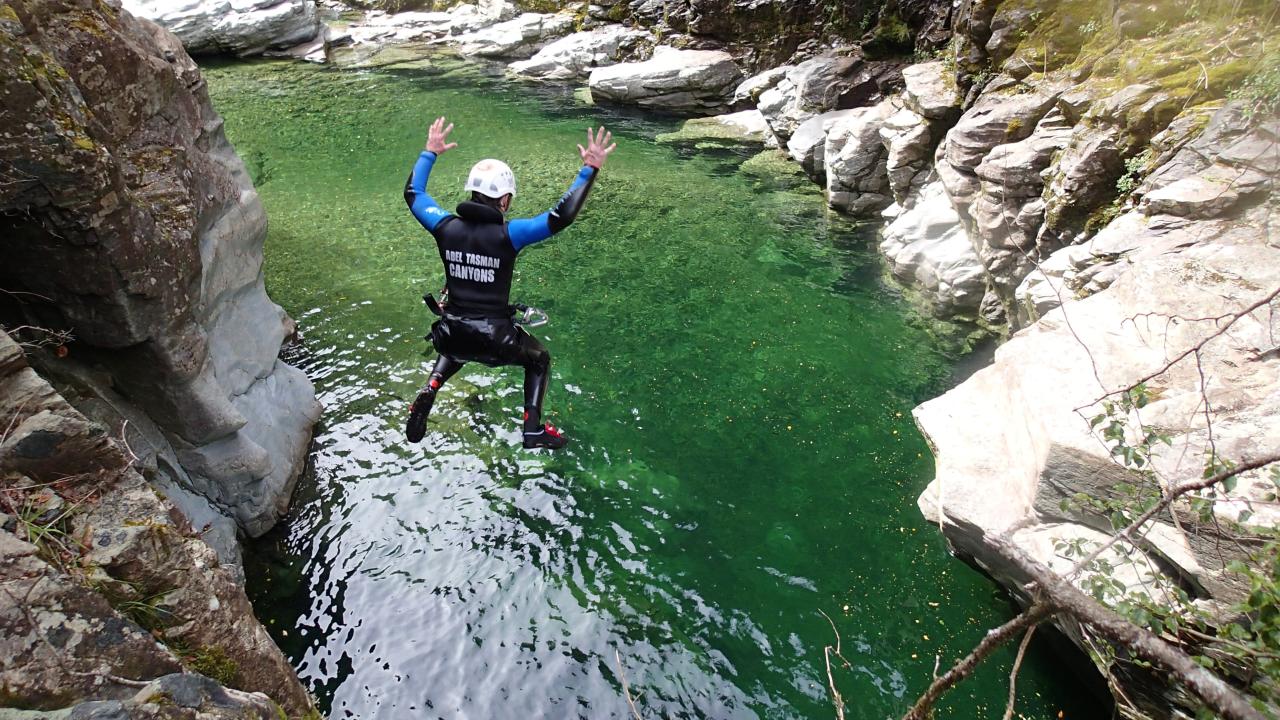 Jumping off the cliff into crystal clear pools
