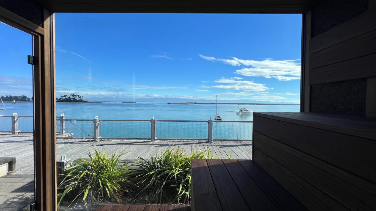The full wall of glass offers unparalleled views of the sea.