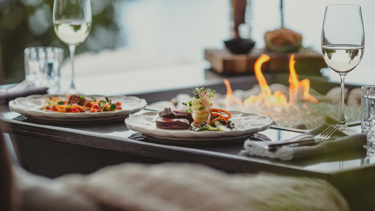 Private fireside dining with ocean views