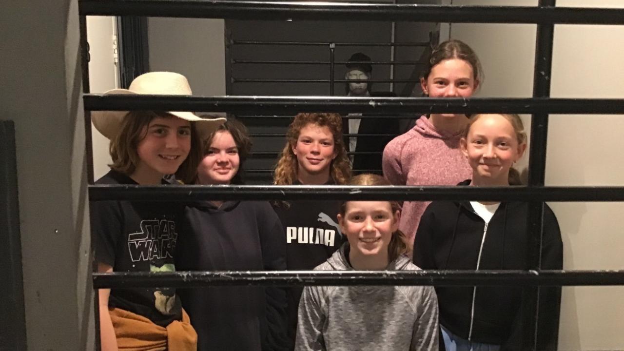 Search across the cell block to uncover hidden clues.