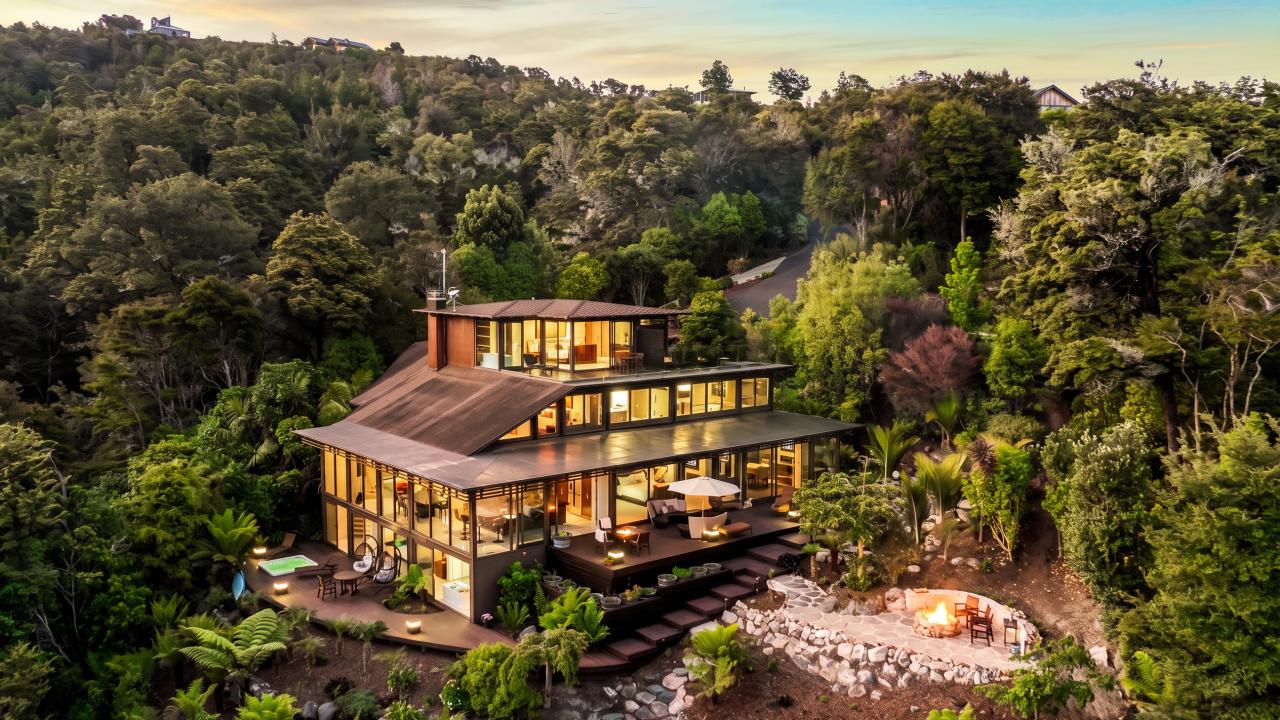 A private forest retreat glowing at sunset