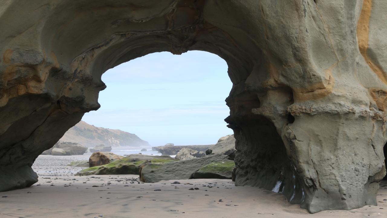 Walk along the beach to the arch