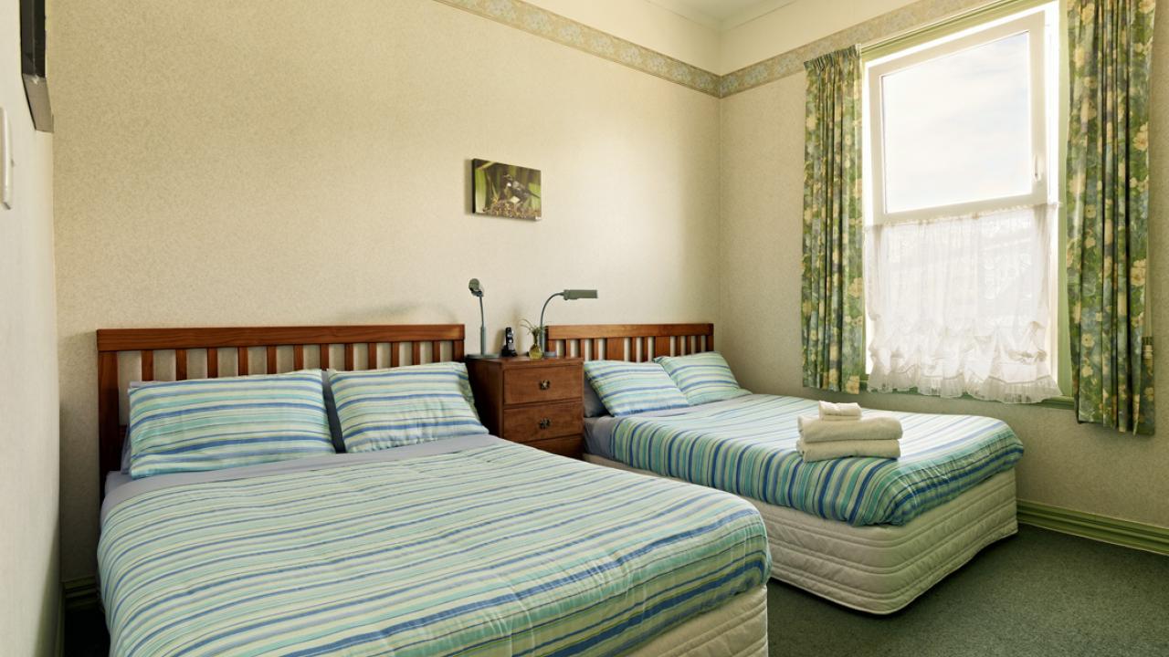 Double glazed Green Room on the ground floor has twin Queen sized beds with air conditioning, en suite shower and wash hand basin. It has a cordless, direct dial phone, Wi-Fi, digital safe, large desk, chair, an LCD flat screen HD colour TV with MP3 playb
