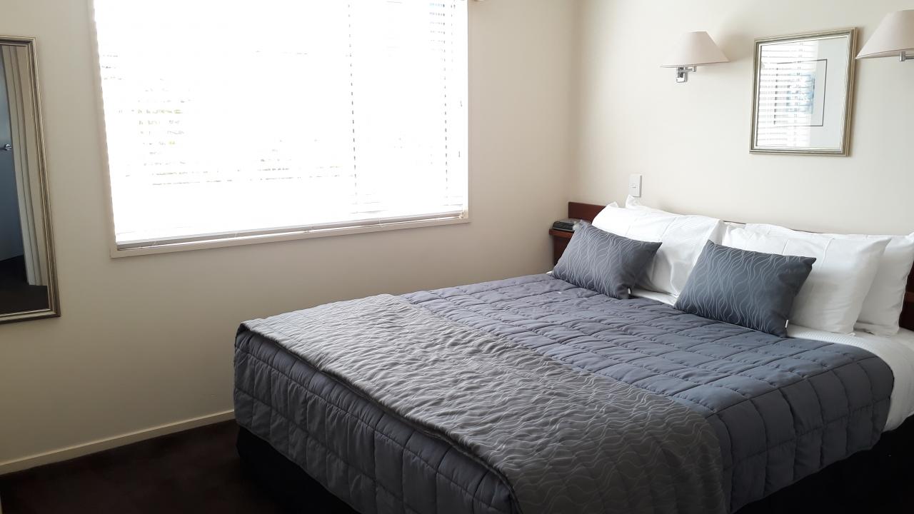 Bedroom 1 with king bed and TV - 2 bedroom unit