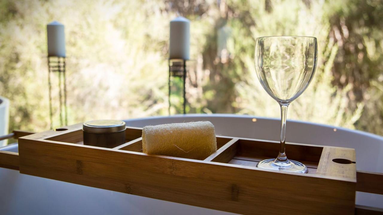 Glass of wine and light a candle while having a deep soak bath.