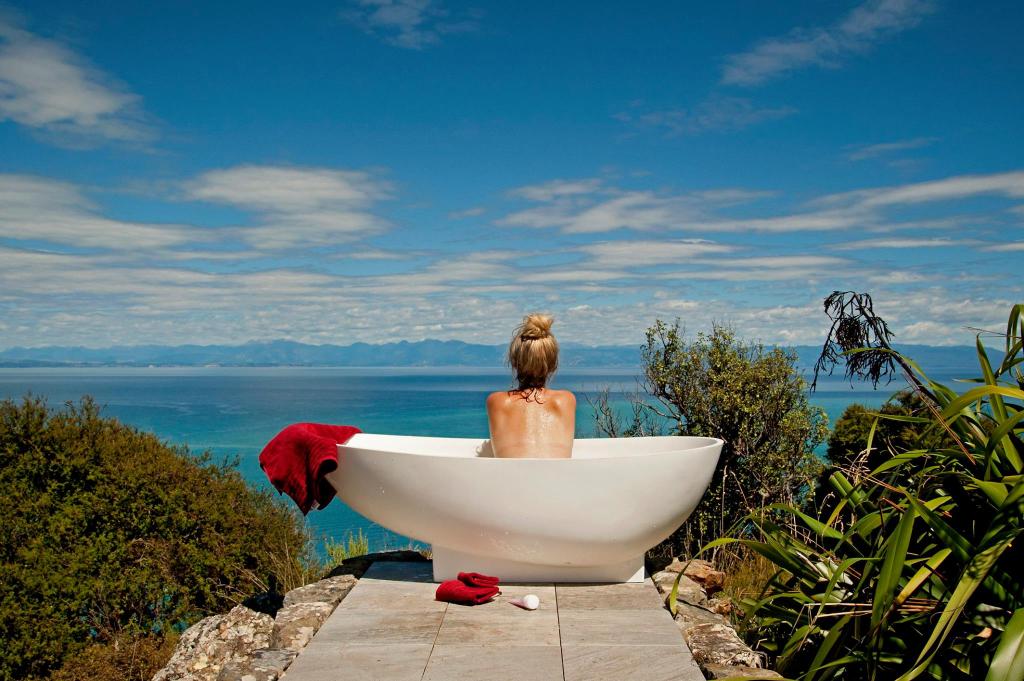 Outdoor bath tub, panoramic view of Tasman Bay