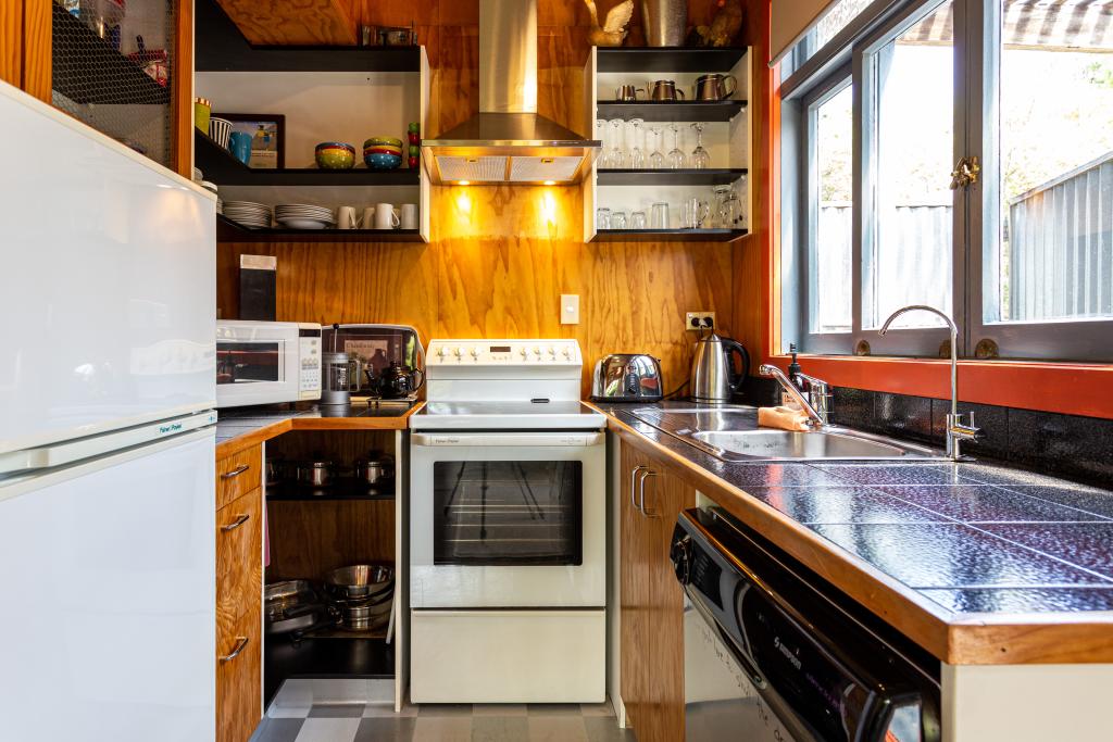 Kitchen. Dishwasher, stove, microwave and fridge.