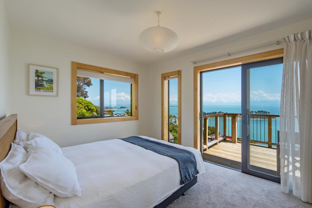 Masters bedroom with Queen bed and sea views.