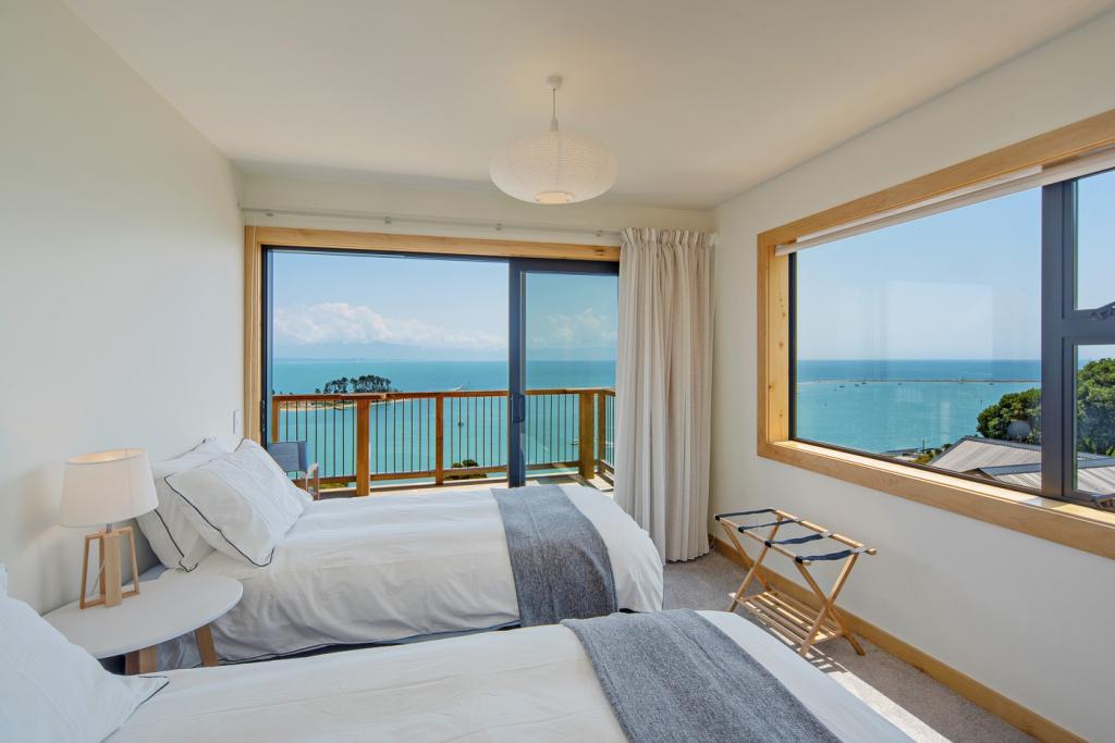 Bedroom 2 with two Single beds (or King by early request) & incredible sea views.