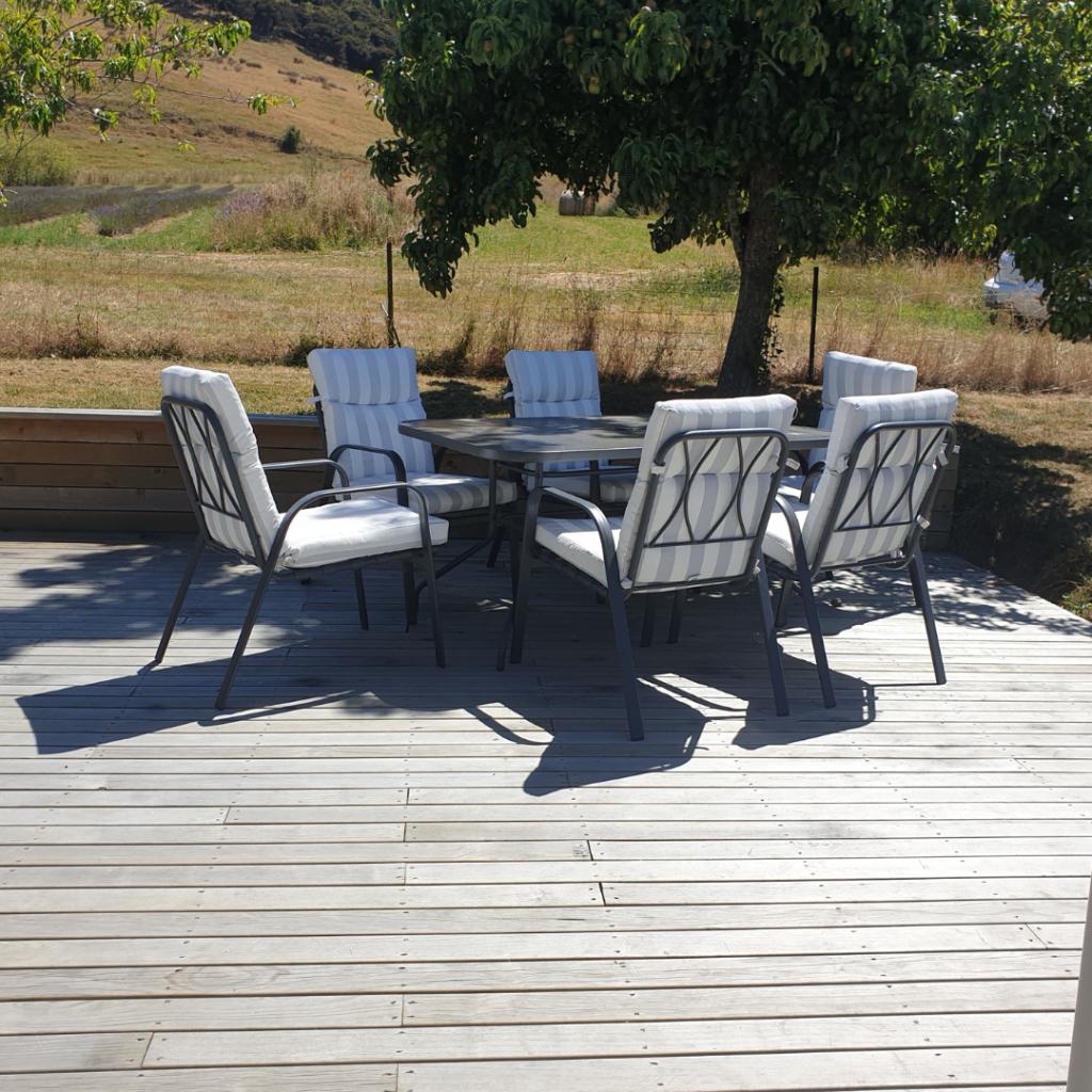 Extensive private patio looking out over lavender field Lavender Row Farm