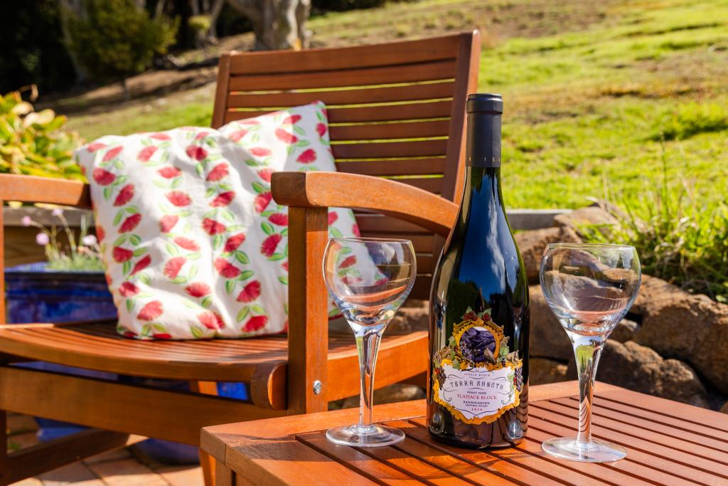 Fully sheltered and bathed in sunlight, the private patio offers the perfect spot for an afternoon of reading, relaxation, or a glass of wine. Simone Jackson